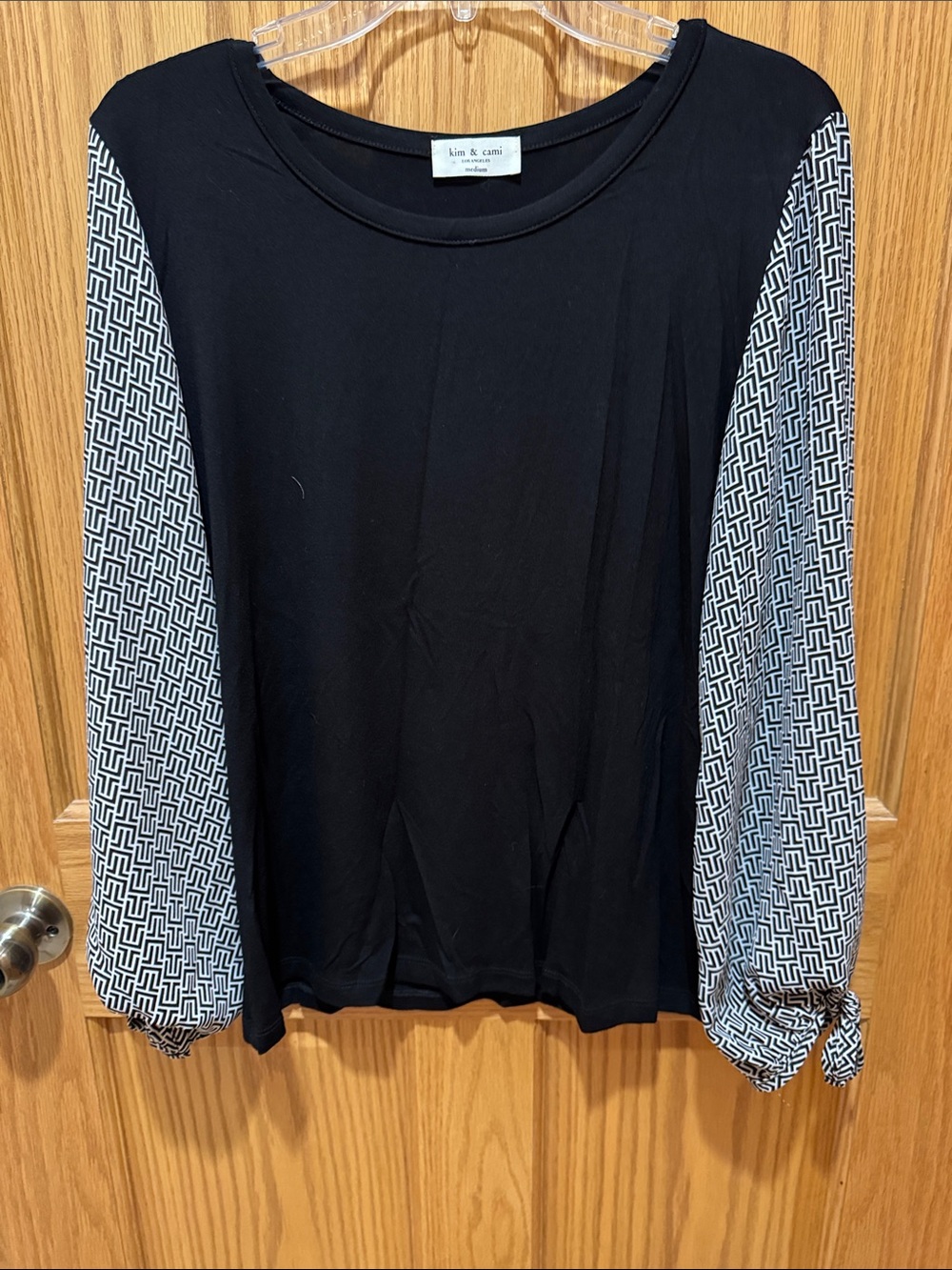 Kim & Cami Black Pullover Top with Geometric White-and-Black Sleeves